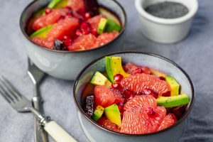 Fruit salad with grapefruit, avocado, beetroot and pomegranate.